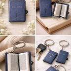 Blue keychain shaped like an open book with a cross on a wooden surface.