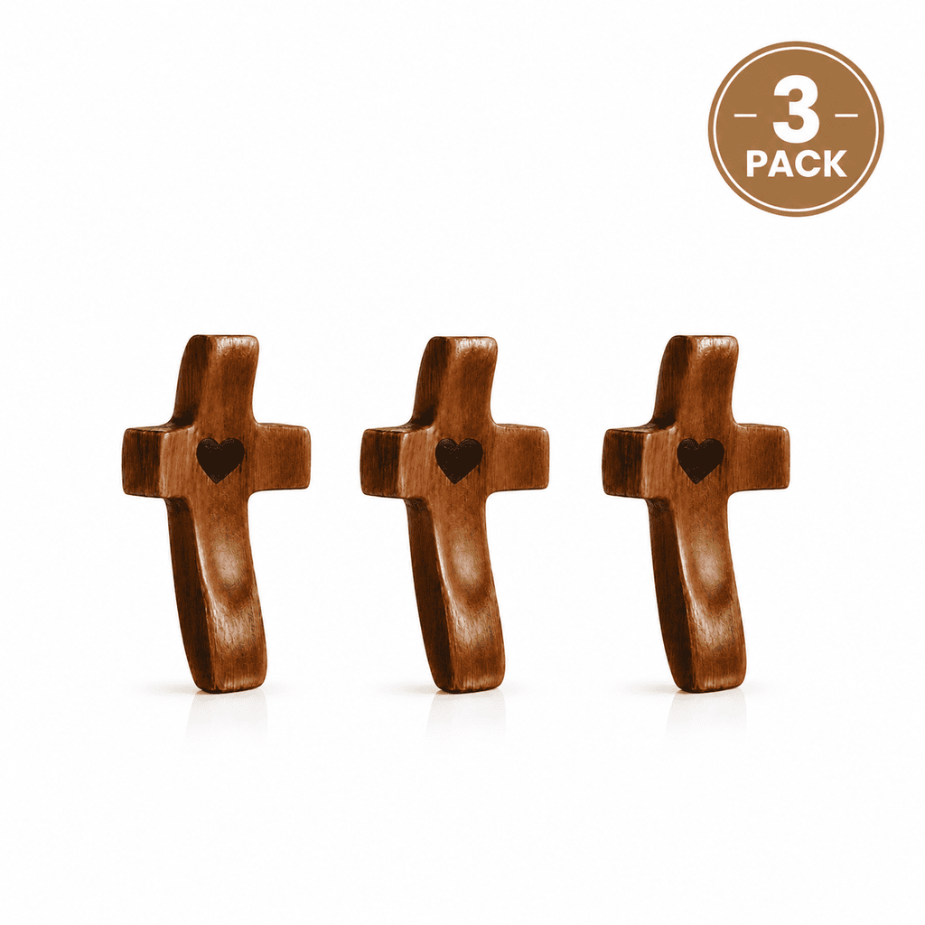 Three wooden crosses with heart shapes on a white background