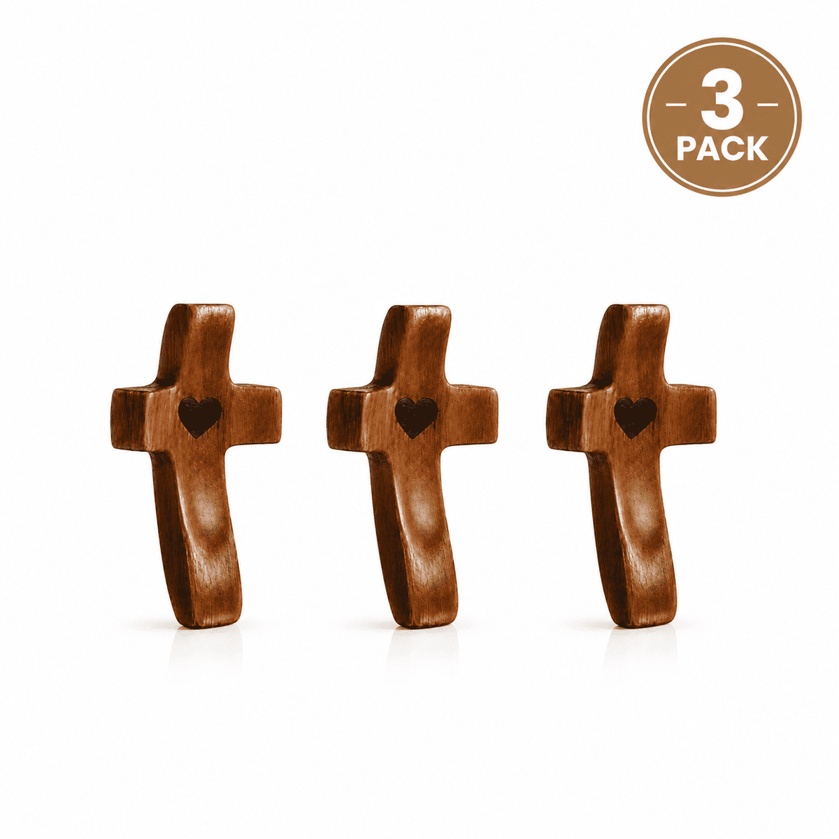 Three wooden crosses with heart shapes on a white background