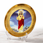 Decorative plate with a religious figure on a gold rim, displayed on stands.