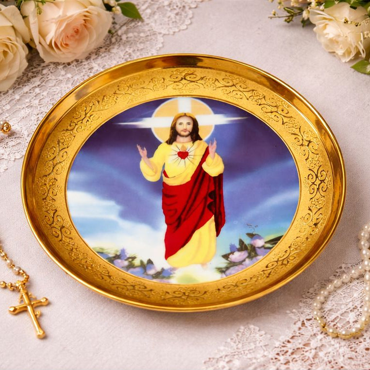 Decorative plate with a religious figure on a gold rim, surrounded by flowers and a rosary.