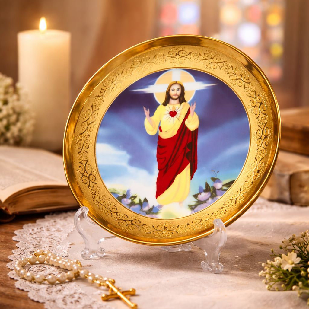 Decorative plate with a religious figure on a stand, surrounded by candles and flowers.